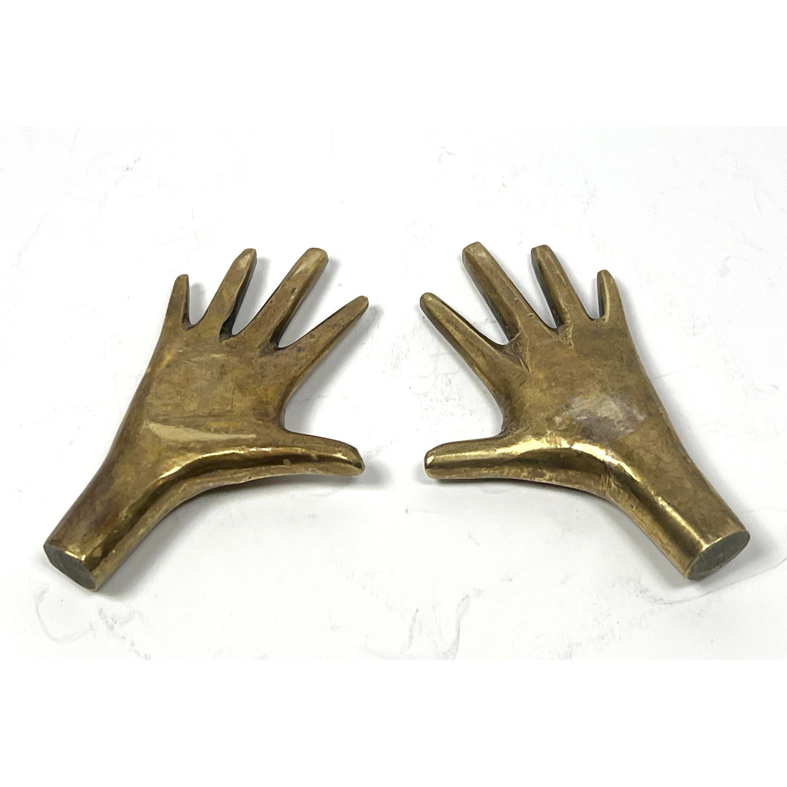 Pair After Aubock Bronze Small Hand Sculptures.: Pair After Aubock Bronze Small Hand Sculptures. Dimensions: Height: 3.25 inches, Width: 2.25 inches, Depth: .5 inches. --- US Packing and Shipping charge: $20 Plus insurance at a rate of $1 per hundre