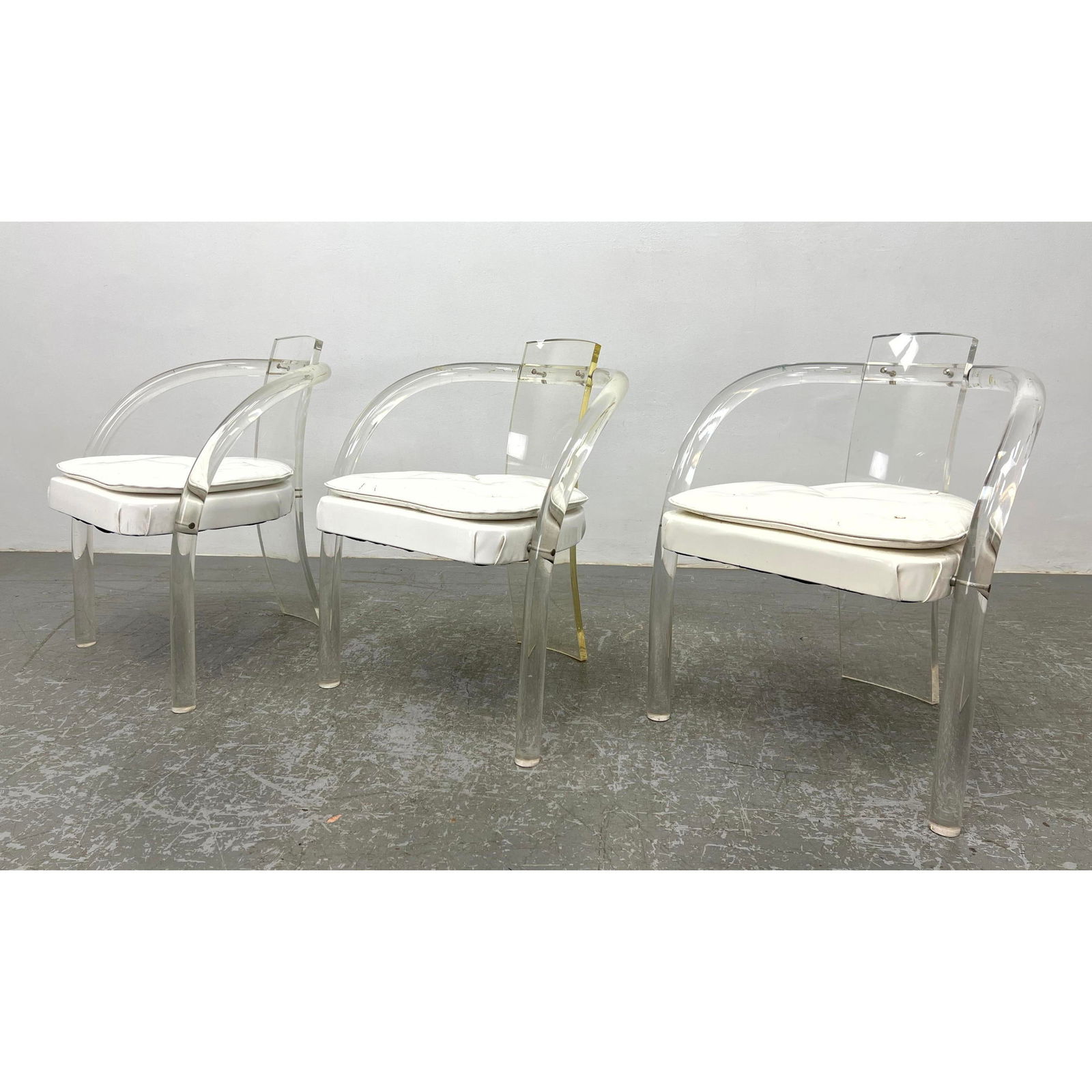 3pc CHARLES HOLLIS JONES Lucite Chairs. Lucite tube barrel back construction, White vinyl seats.: 3pc CHARLES HOLLIS JONES Lucite Chairs. Lucite tube barrel back construction, White vinyl seats. Dimensions: Height: 29 inches, Width: 24 inches, Depth: 22 inches. - Seat Height: 18.5 inches ---