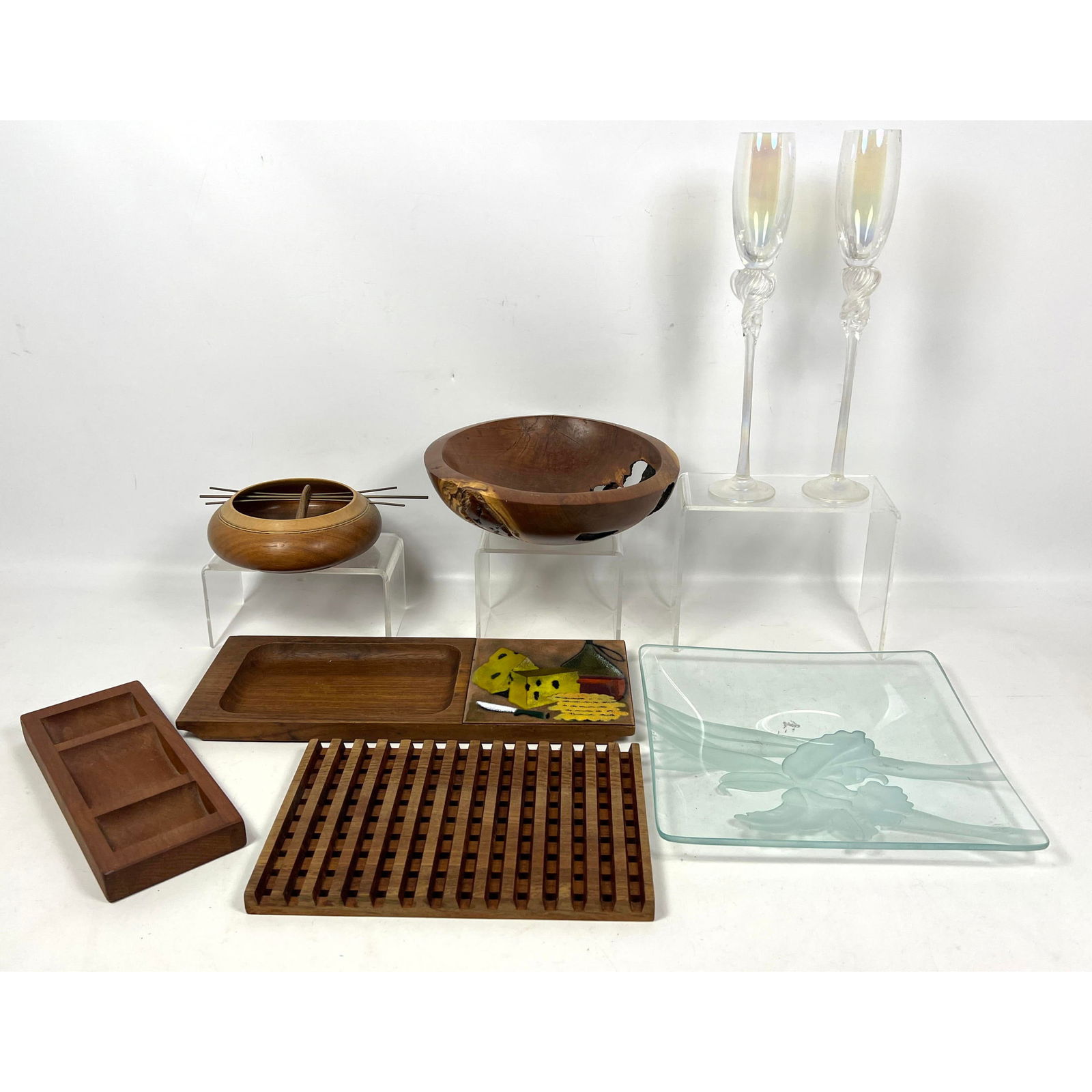 Mixed Artisan Craft Lot. Wood. Glass. Teak Trivet. Serving trays (one with enamel panel). DAVE THOM: Mixed Artisan Craft Lot. Wood. Glass. Teak Trivet. Serving trays (one with enamel panel). DAVE THOMPSOM Locust Natural Bowl. Pr Signed Artist Signed Art Glass Champagne Flutes. Dimensions: Height: 3.5