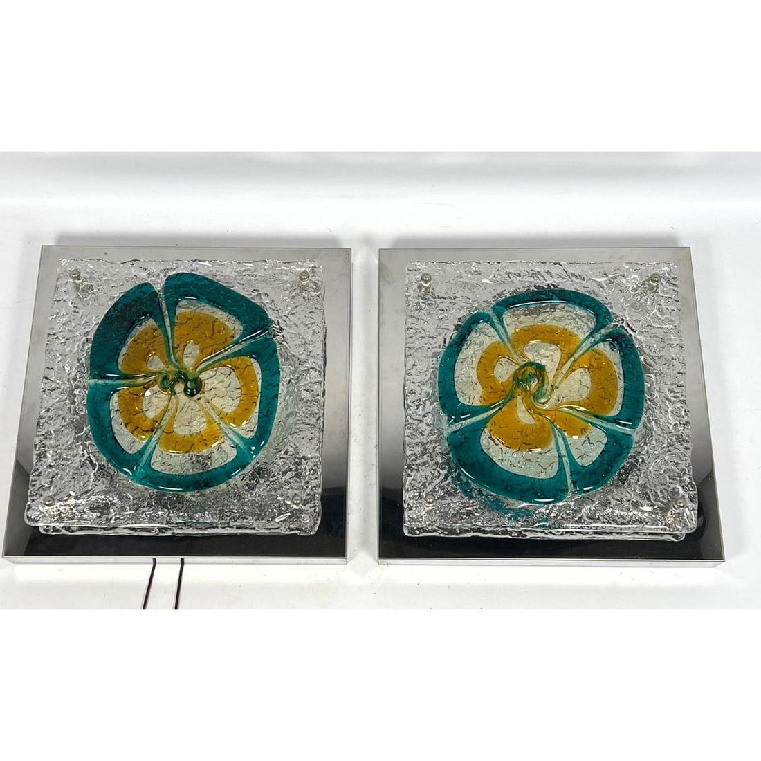 Pair of Mazzega Turquoise and Orange glass and chrome sconces. Textured glass panels. Modernist Ligh: Pair of Mazzega Turquoise and Orange glass and chrome sconces. Textured glass panels. Modernist Lighting. Dimensions: Height: 14 inches, Width: 14 inches, Depth: 3 inches. --- US Packing and Shipping 