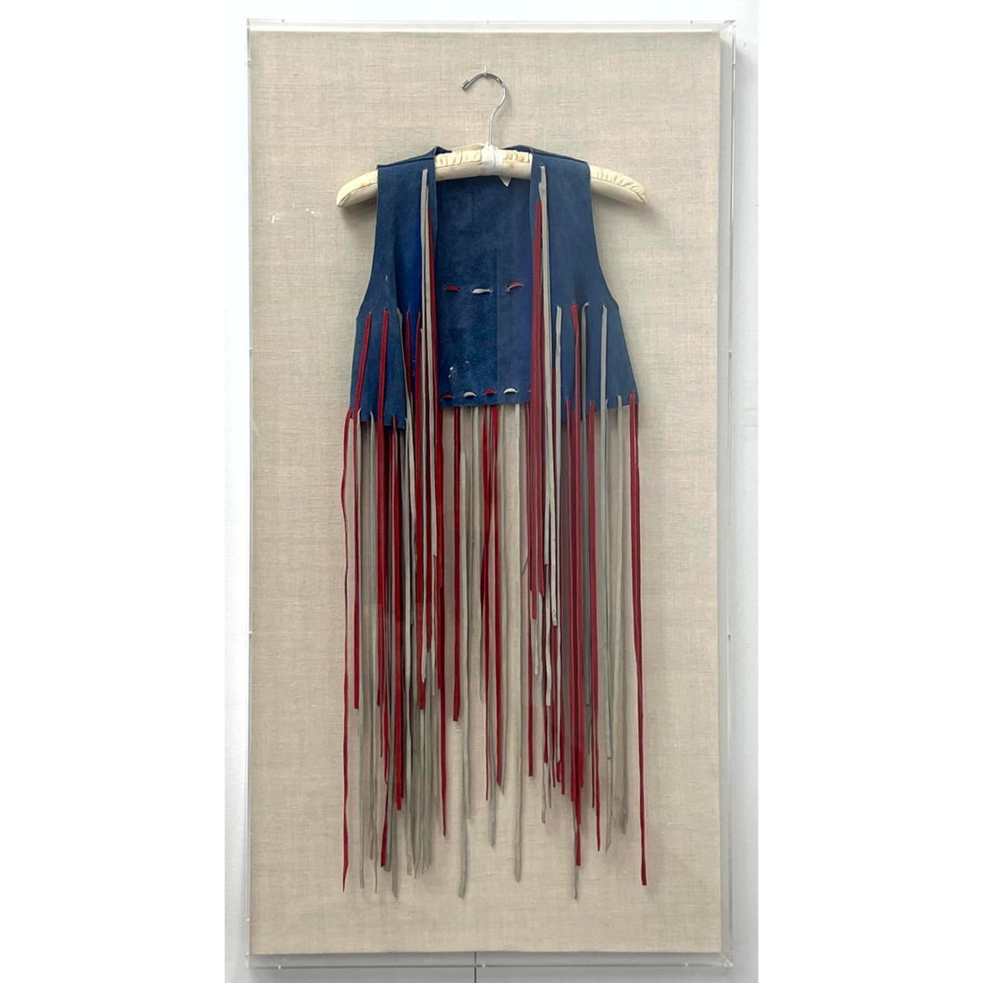 Vintage Suede Red White and Blue Patriotic Hippie Tassel Vest. Mounted in Lucite Box Framed: Vintage Suede Red White and Blue Patriotic Hippie Tassel Vest. Mounted in Lucite Box Framed Dimensions: Height: 50.5 inches, Width: 26.5 inches. --- - We offer curbside delivery for most items to NYC,