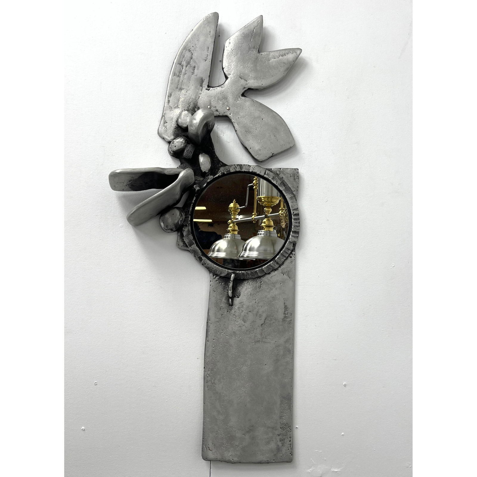 Brutalist Don Drumm Attributed Modernist Wall Mirror. Sculptural Drumm form aluminum has small round: Brutalist Don Drumm Attributed Modernist Wall Mirror. Sculptural Drumm form aluminum has small round mirror. Not marked. . Dimensions: Height: 44 inches, Width: 16.5 inches, Depth: 8 inches. --- - We
