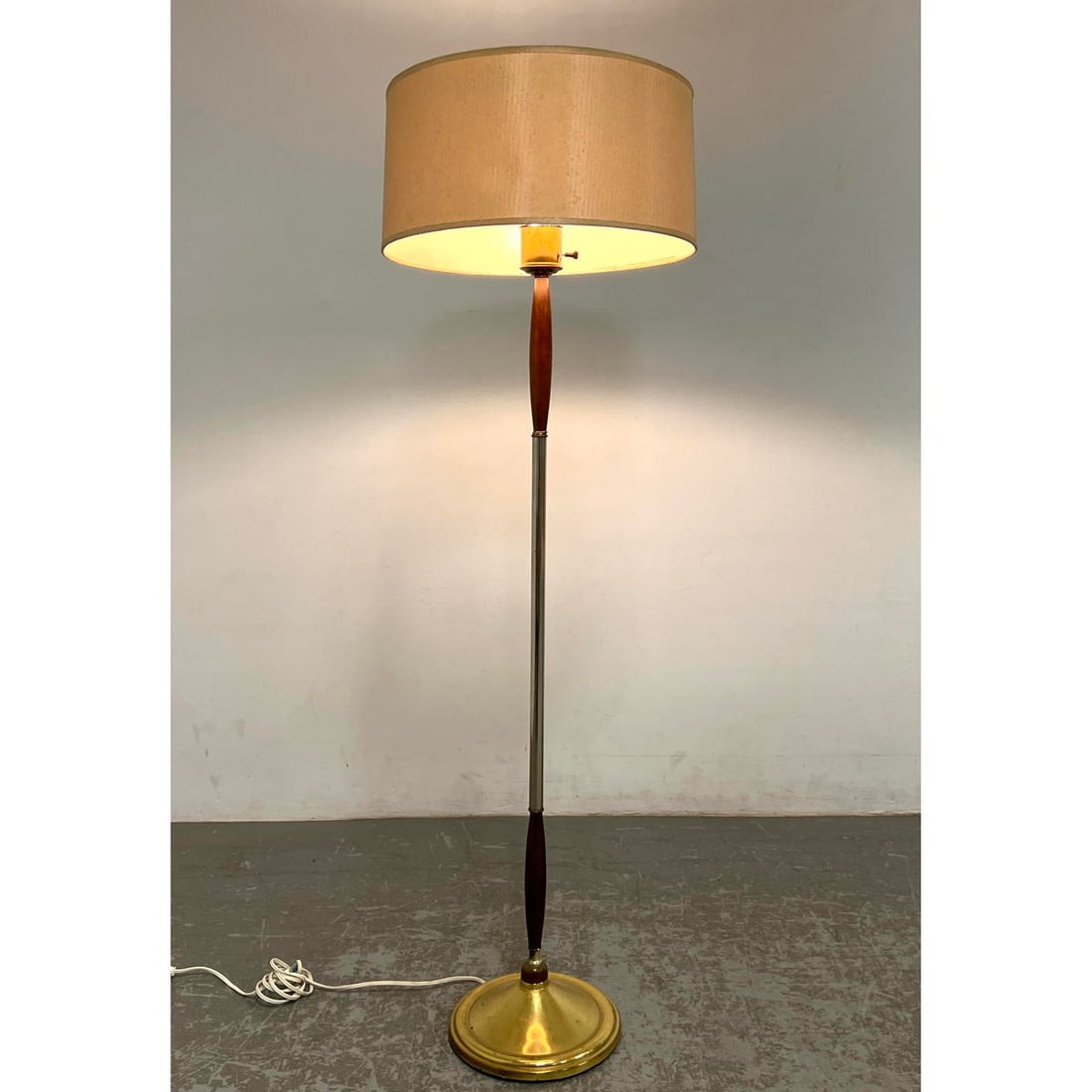 Mid Century Floor Lamp Metal Stem with two wood elements.: Mid Century Floor Lamp Metal Stem with two wood elements. Dimensions: Height: 58 inches, Width: 17.5 inches, Depth: 17.5 inches. --- - We offer curbside delivery for most items to NYC, Manhattan, Clos
