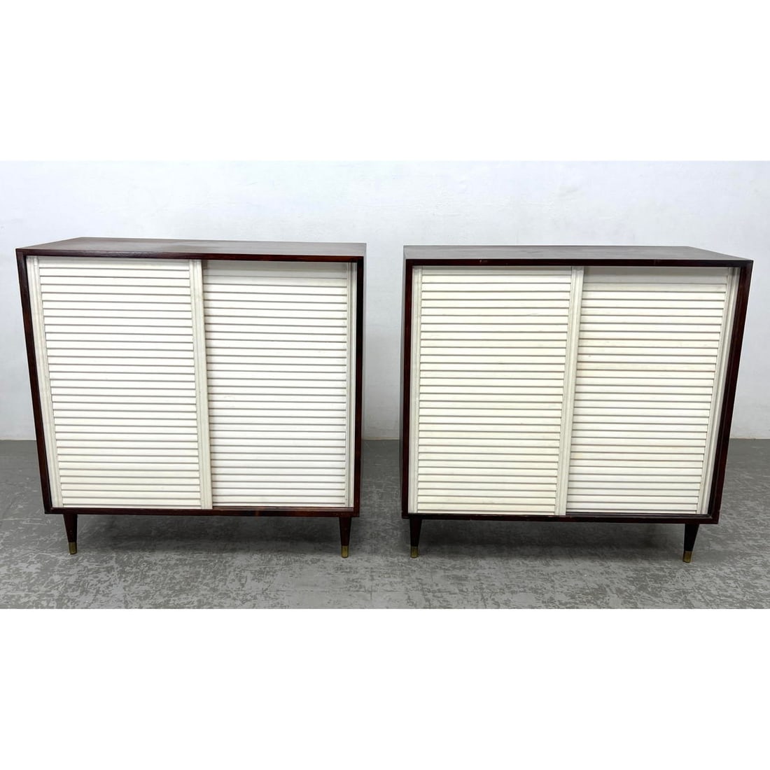 Pair Mid Century Modern Sliding Door Cabinets.: Pair Mid Century Modern Sliding Door Cabinets. Dimensions: Height: 36.5 inches, Width: 35.75 inches, Depth: 16 inches. --- - We offer curbside delivery for most items to NYC, Manhattan, Close Brooklyn