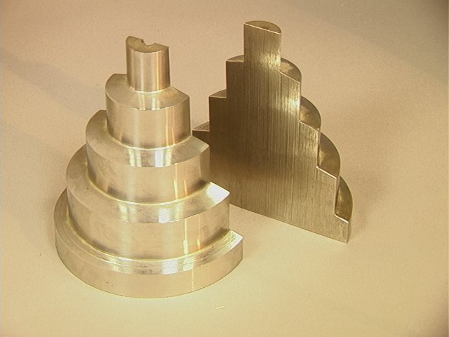 Heavy Steel Industrial Bookends. Stacking Tiered: Heavy Steel Industrial Bookends. Stacking Tiered Steel Rings. Unmarked.-- Dimensions: H: 6 inches: W: 5.5 inches: D: 2.5 inches --- US Shipping charge: $28