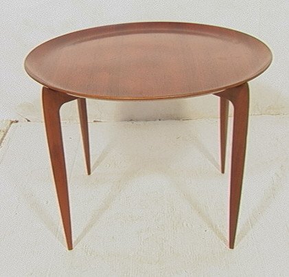 FRITZ HANSEN Teak Denmark Tray Top Table. Folding: FRITZ HANSEN Teak Denmark Tray Top Table. Folding base with tapered legs. Round tray table with beveled lip. Tray marked FH in circle. Stamped mark. -- Dimensions: H: 17 inches: W: 23 inches: D: 23 in