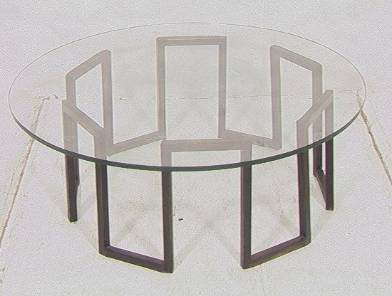 Round Glass Cocktail Coffee Table. 3/4" thick gla: Round Glass Cocktail Coffee Table. 3/4" thick glass top on metal wall of troy base. Metal is black. -- Dimensions: H: 16 inches: W: 42 inches: D: 42 inches ---