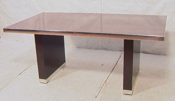 PIERRE CARDIN Brown Lacquer Chrome Dining Table.: PIERRE CARDIN Brown Lacquer Chrome Dining Table. Chrome Trim. Two trestle feet with Chrome. Two 18" Leaves. Signed on Side. -- Dimensions: H: 29.5 inches: D: 38 inches: L: 72 inches ---