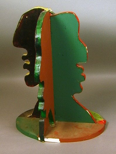 EARL WILKIE Colorful four sided Face Sculpture. F: EARL WILKIE Colorful four sided Face Sculpture. Four sculptural profiles. Wilkie experimented with carving laminated wood sculptures for a long period of his career. Wilkie was a Philadelphia Universi