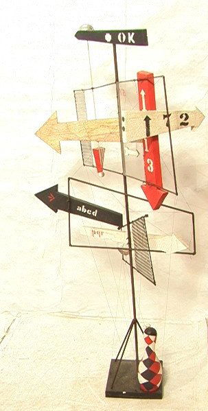 6' Tall WOLFGANG ROTH Arrow Sculpture. Colorful G: 6' Tall WOLFGANG ROTH Arrow Sculpture. Colorful Graphic POP ART Sculpture. Painted Metal & Wood Arrows and Maps. American Artist. Unsigned. WOLFGANG ROTH, German American, 1910-1988. In Dec. 2006, the
