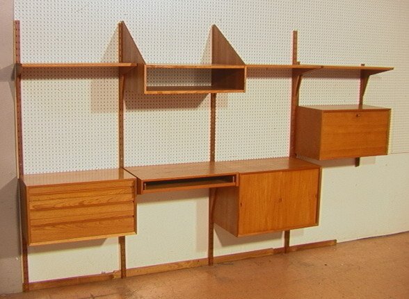 Poul CADOVIUS Cado Wall Unit Shelf Cabinet. Teak: Poul CADOVIUS Cado Wall Unit Shelf Cabinet. Teak with 4 tall uprights, 2 short uprights, 3 shelves, 1 drop down cabinet, 1 sliding door cabinet, 1 three drawer cabinet, 1 pull out section, and 1 open 