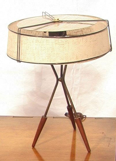GERALD THURSTON Iron Walnut Tripod Table Lamp. Am: GERALD THURSTON Iron Walnut Tripod Table Lamp. American Modern. Iron Legs with wood feet. Original shade with black metal frame. Thurston for Lightolier attribution.-- Dimensions: H: 21 inches: W: 16