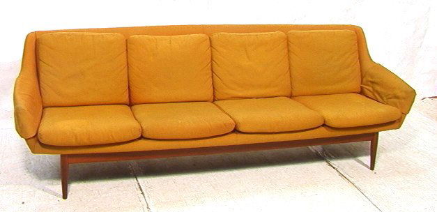 Danish Modern Sofa Couch. Four Seater on Teak Peg: Danish Modern Sofa Couch. Four Seater on Teak Peg Leg Frame. Fabric upholstery.-- Dimensions: H: 30 inches: D: 33 inches: L: 94 inches ---