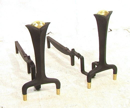 Pr Donald Deskey Bennett Andirons. Fireplace.: Pr Donald Deskey Bennett Andirons. Fireplace. Brass and black iron. Marked.-- Dimensions: H: 15 inches: W: 7.5 inches: D: 23.5 inches ---