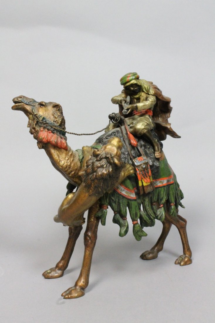 Large Franz Bergman Bronze Sculpture. Arab: Large Franz Bergman Bronze Sculpture. Arab on Camel Fighting a Lion. Both pieces signed.-- Dimensions: H: 9 inches: W: 7 inches: D: 6 inches --- US Shipping charge: $28