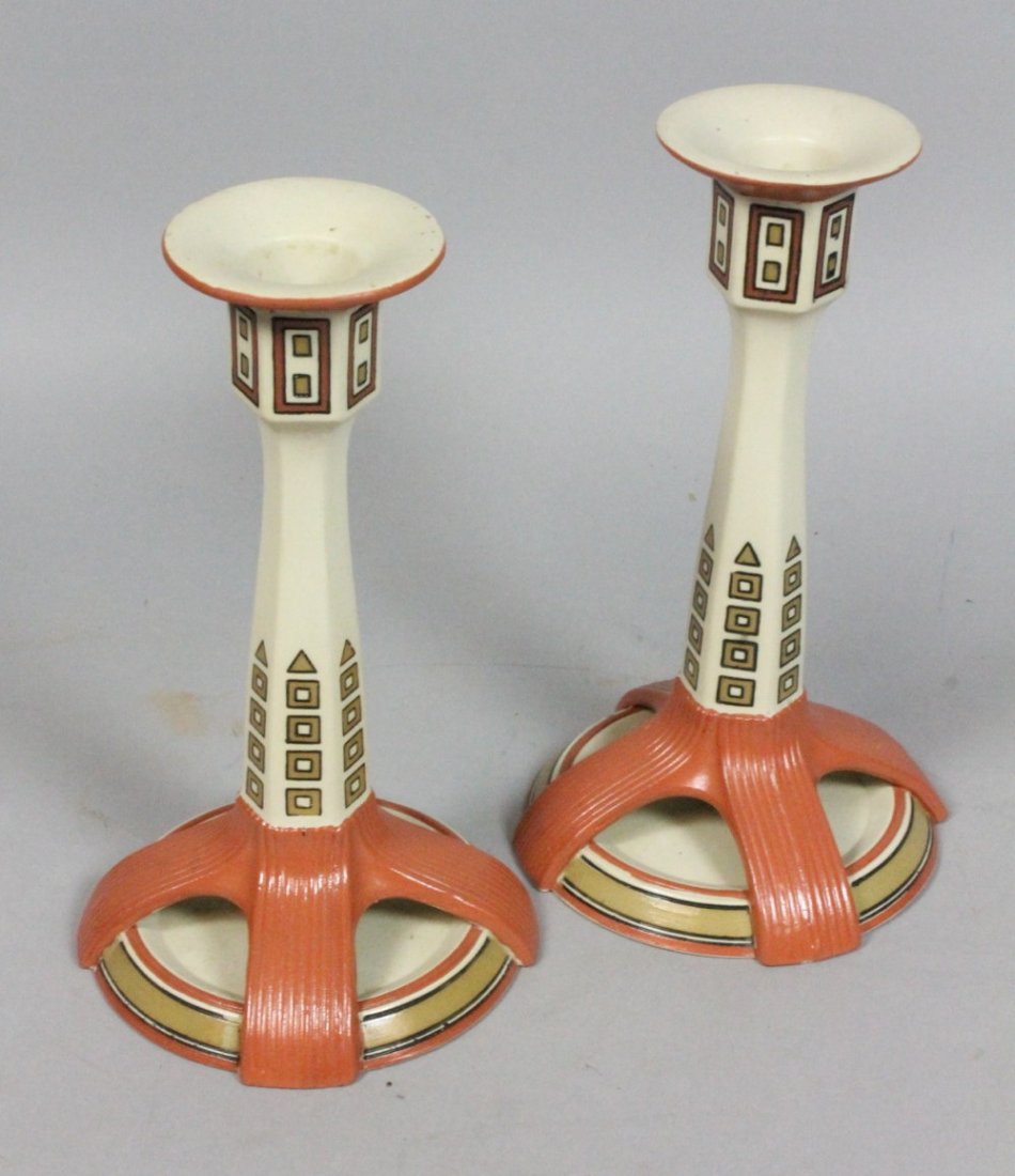 Pair Mettlach Arts and Crafts Candle Sticks. Dec: Pair Mettlach Arts and Crafts Candle Sticks. Decorated candlesticks with open work bases.-- Dimensions: H: 8 inches: W: 4.5 inches --- US Shipping charge: $28