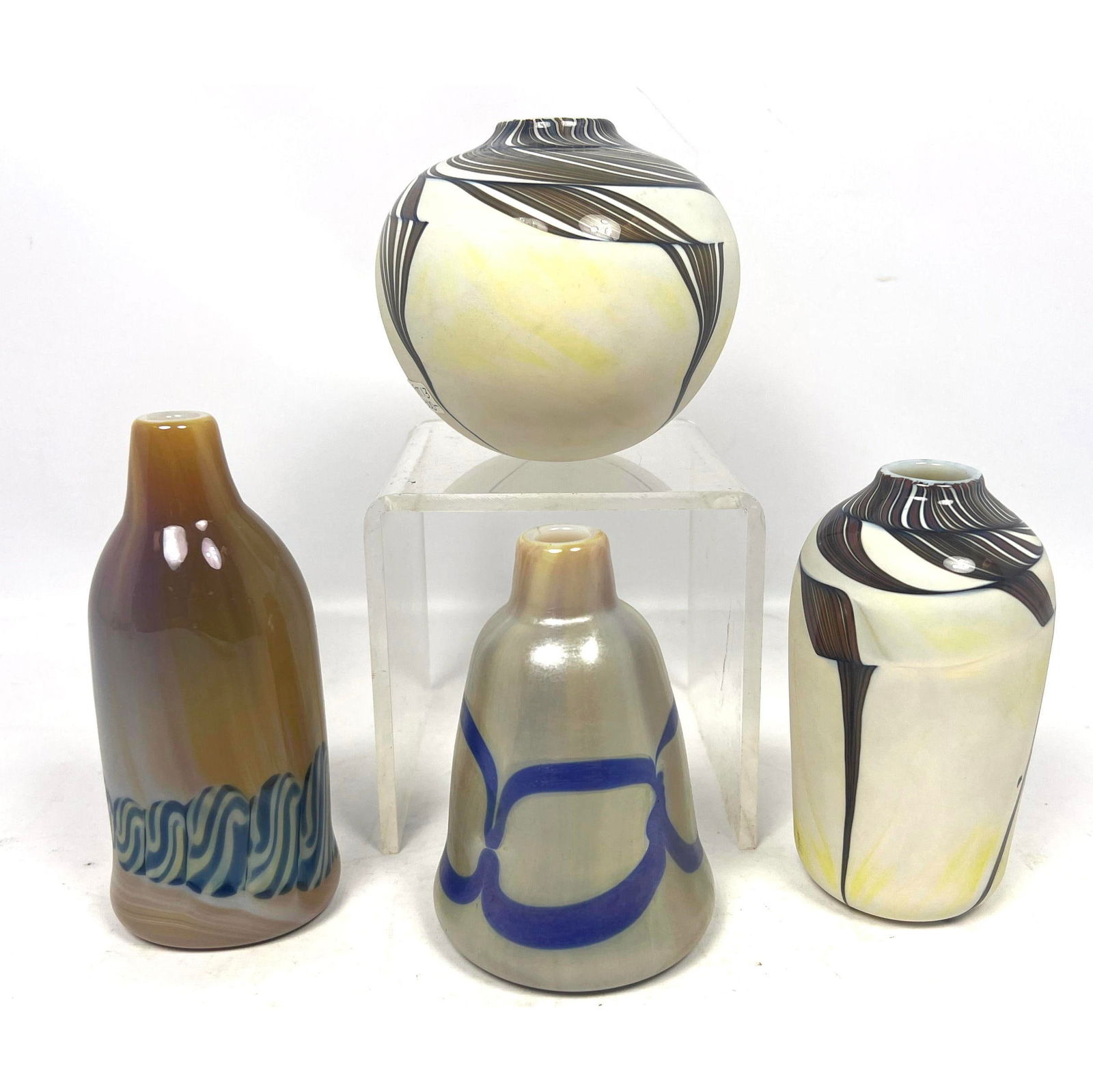 4pc George Thiewes Art Glass Vases.: 4pc George Thiewes Art Glass Vases. Dimensions: Height: 4.5 inches, Width: 4.5 inches, Depth: 4.5 inches. --- US Packing and Shipping charge: In house shipping available. Will be calculated once desti