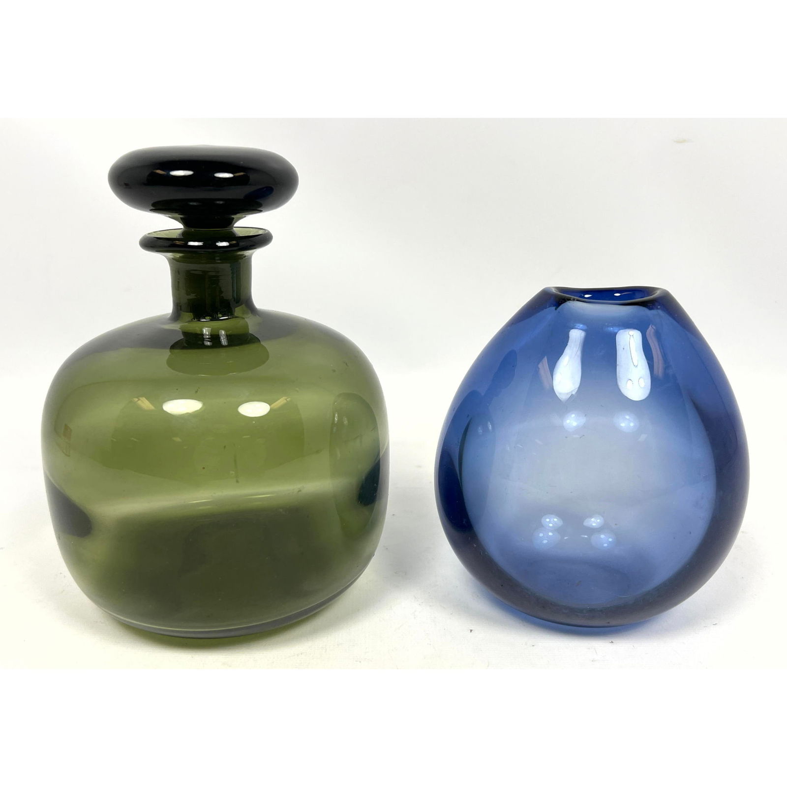 2pc Mid Century Modern Art Glass. Per Lutken for Holmegaard and Kaj Franck Style stoppered bottle.: 2pc Mid Century Modern Art Glass. Per Lutken for Holmegaard and Kaj Franck Style stoppered bottle. Dimensions: Height: 6.5 inches, Width: 5 inches, Depth: 5 inches. - Additional Dimensions: Smaller H: