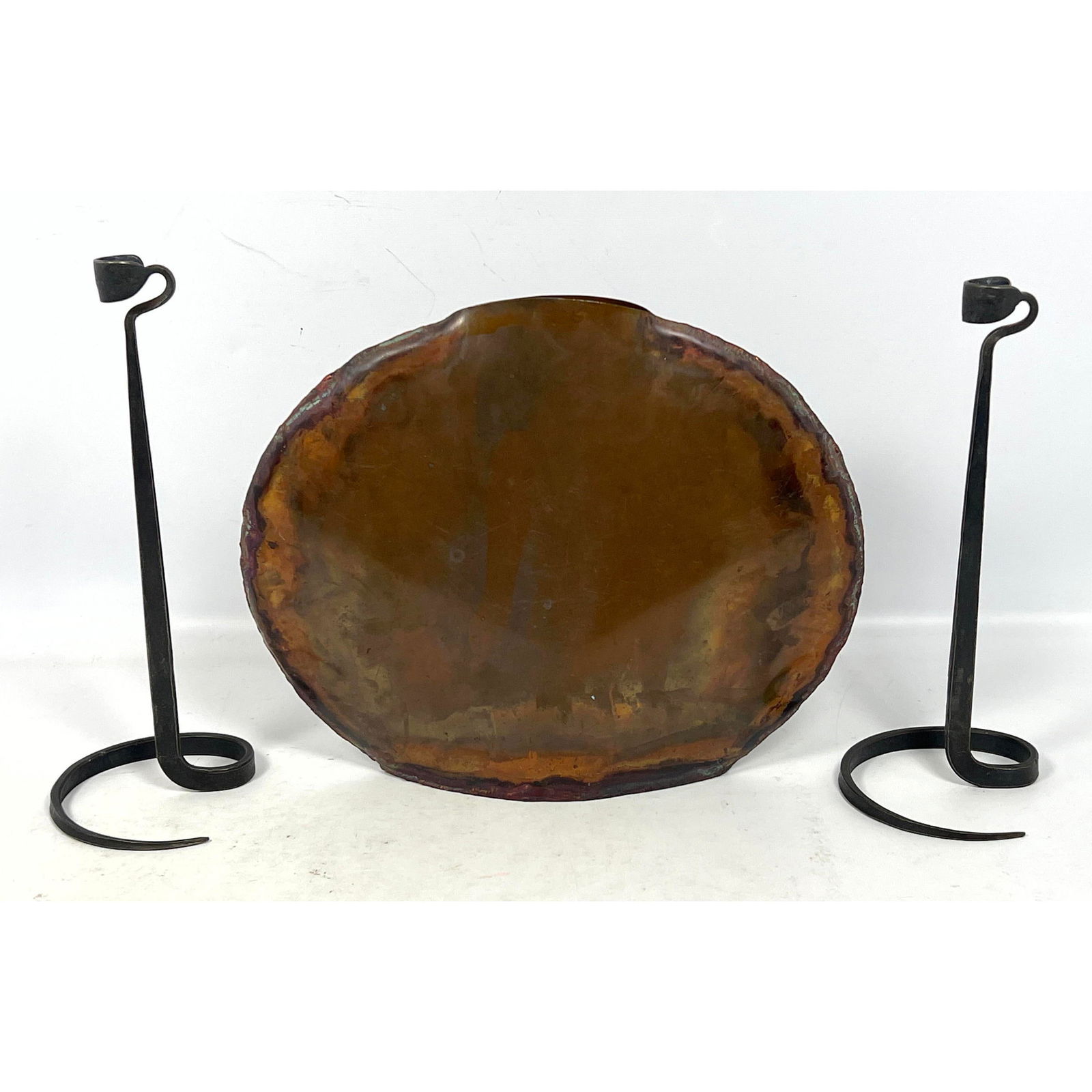 3pc Tablewares Lot. Lance Cloutier style iron candlesticks and Copper Pillow Vase.: 3pc Tablewares Lot. Lance Cloutier style iron candlesticks and Copper Pillow Vase. Dimensions: Height: 10.25 inches, Width: 12.5 inches, Depth: 3 inches. - Additional Dimensions: taller candlestick H: