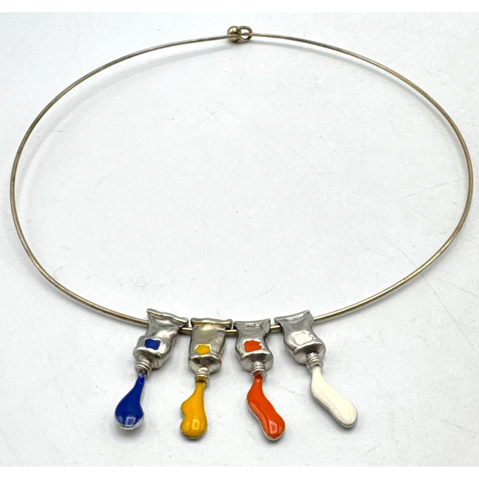 FERNANDEZ ARMAN Paint Tube Necklace. Enamel colored Paint Tubes (1.25" x .25") on 18" collar. Signed (1 of 10)
