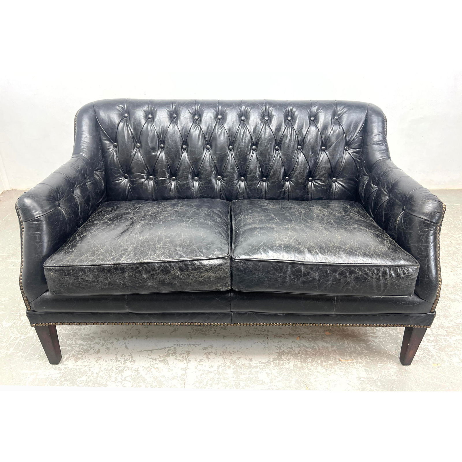 Vintage Tufted Leather Love Seat Sofa. Button back.: Vintage Tufted Leather Love Seat Sofa. Button back. Dimensions: Height: 31 inches, Width: 52.5 inches, Depth: 33 inches. - Seat Height: 19 inches --- - We offer curbside delivery for most items to NYC