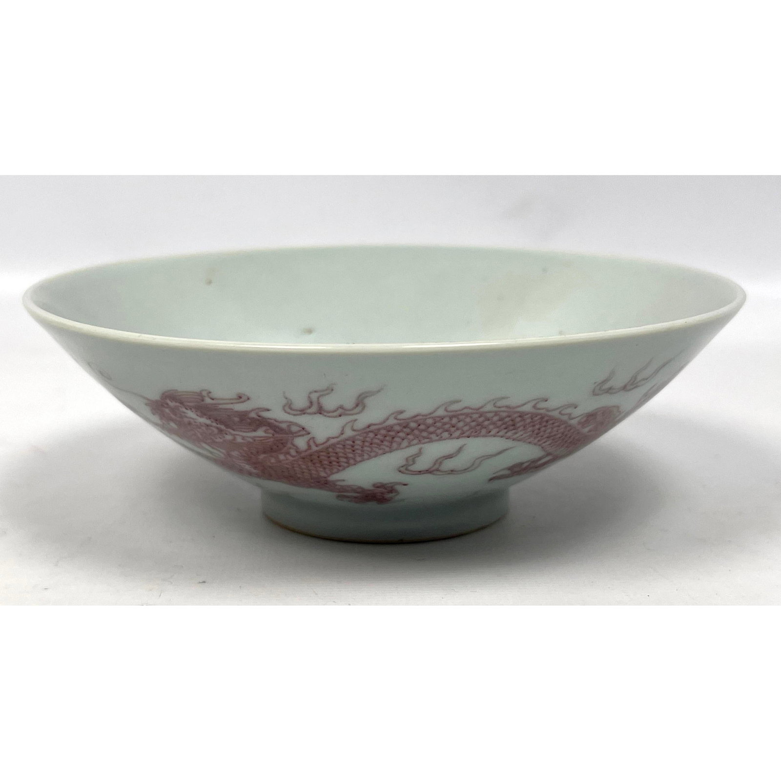 Chinese porcelain dragon bowl marked: Chinese porcelain dragon bowl marked Dimensions: Height: 2 inches, Width: 6 inches, Depth: 6 inches. --- US Packing and Shipping charge: $35 Plus insurance at a rate of $1 per hundred. - We offer curb