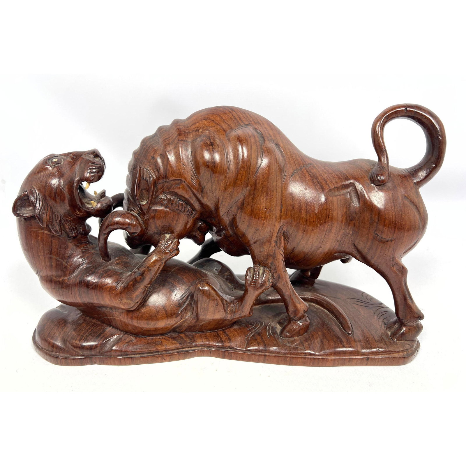 Large Carved Wood Bull and Lioness Sculpture. Fighting Animals.: Large Carved Wood Bull and Lioness Sculpture. Fighting Animals. Dimensions: Height: 8.5 inches, Width: 15.5 inches, Depth: 6 inches. --- US Packing and Shipping charge: In house shipping available. Wi