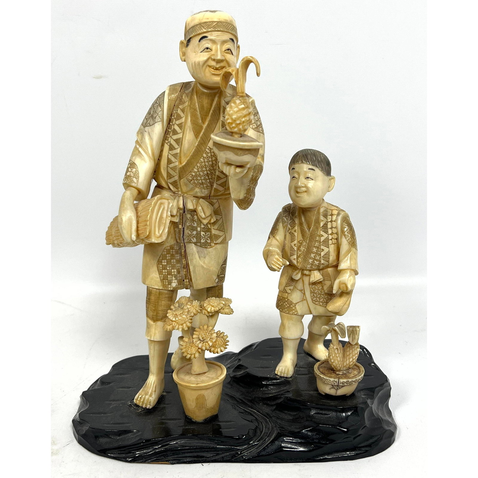 Carved Japanese Figural Grouping.: Carved Japanese Figural Grouping. Dimensions: Height: 9 inches, Width: 7 inches, Depth: 4 inches. --- US Packing and Shipping charge: In house shipping available. Will be calculated once destination k