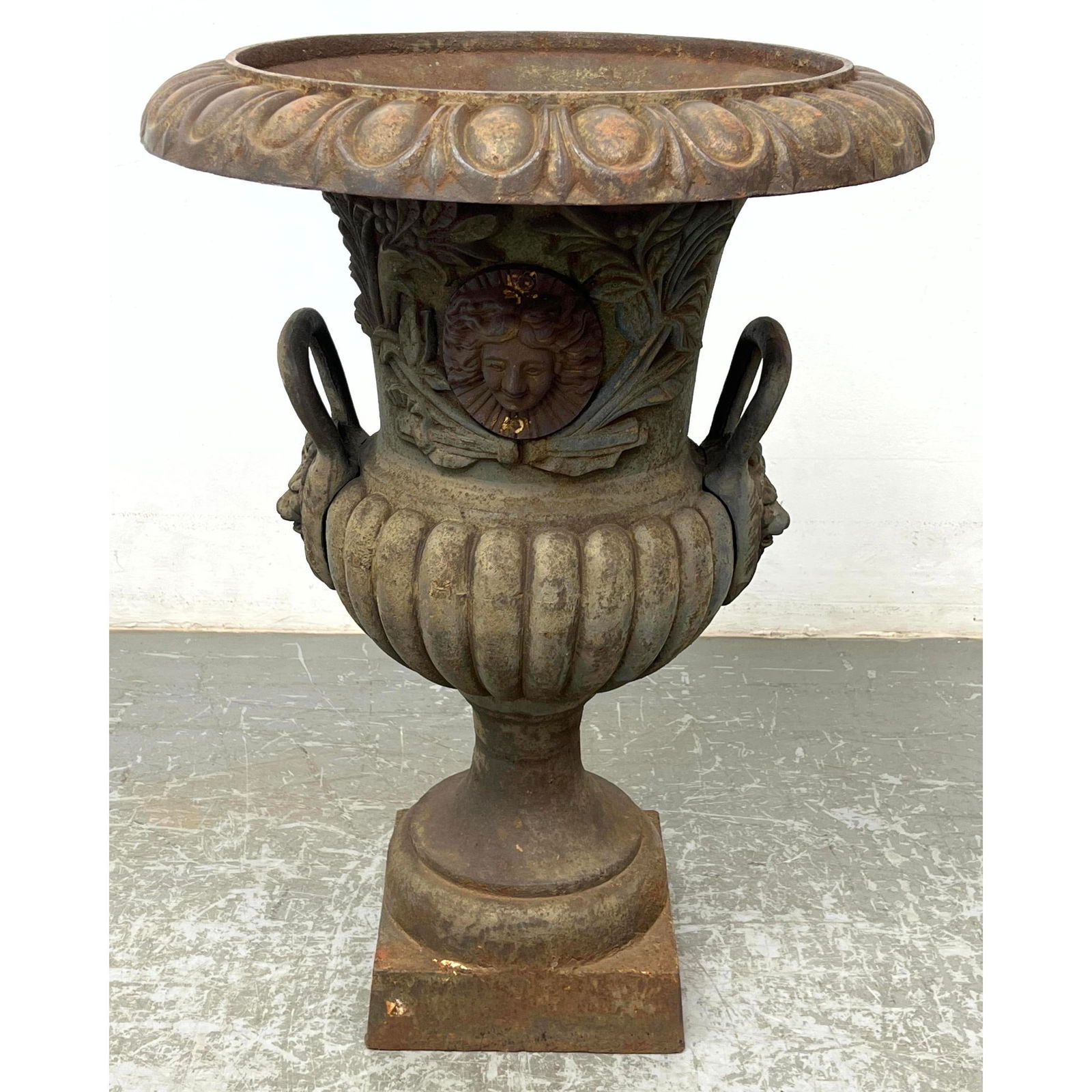 Vintage cast iron urn shaped planter with lions and applied facial decoration (1 of 12)