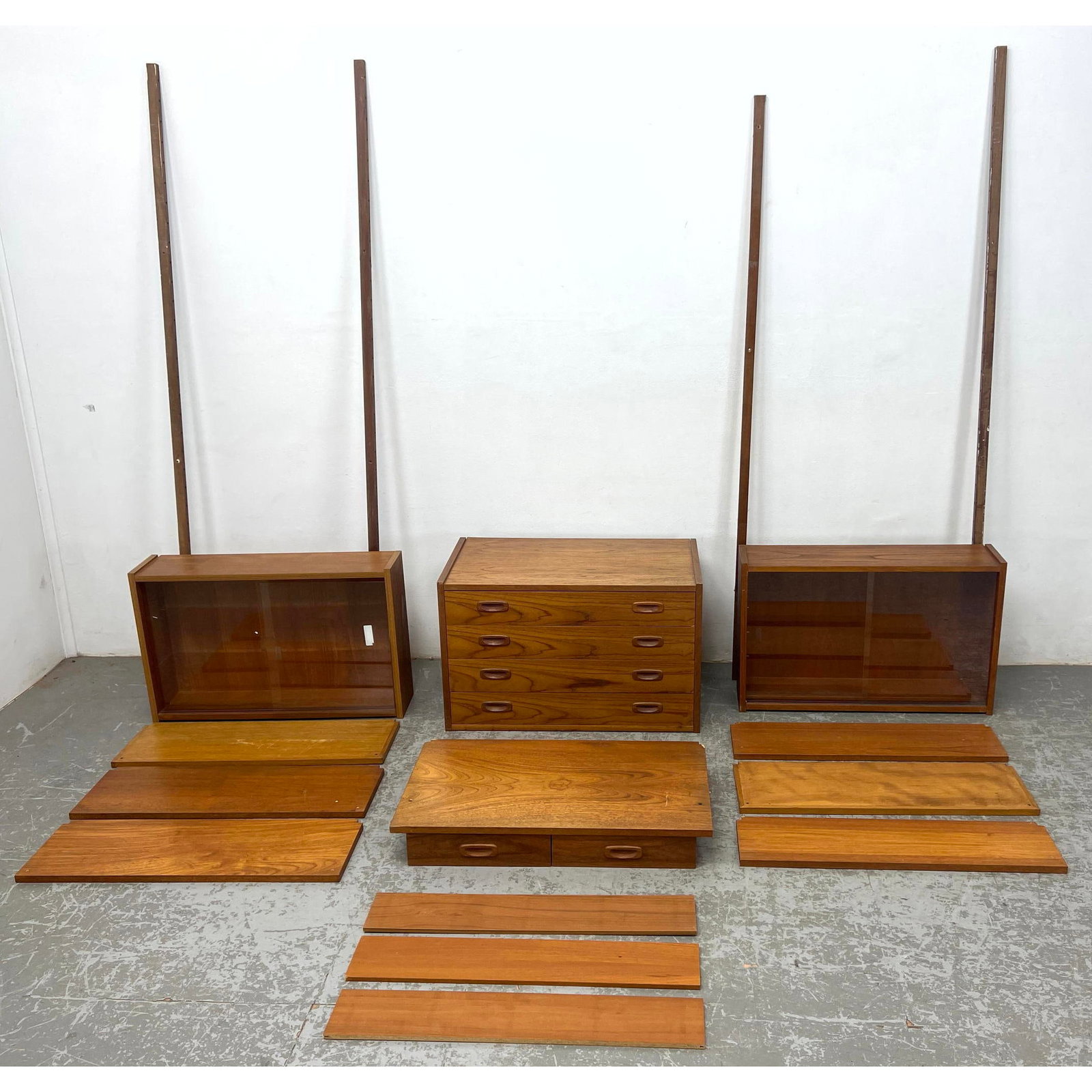 RANDERS Danish Modern Teak PS Shelf System. 3 Cabinets and Desk. 9 Shelves. 4 upright Wall Mounts an: RANDERS Danish Modern Teak PS Shelf System. 3 Cabinets and Desk. 9 Shelves. 4 upright Wall Mounts and Metal Brackets. Label. See Last Photo for unit assembled. Dimensions: Height: 80 inches, Width: 94