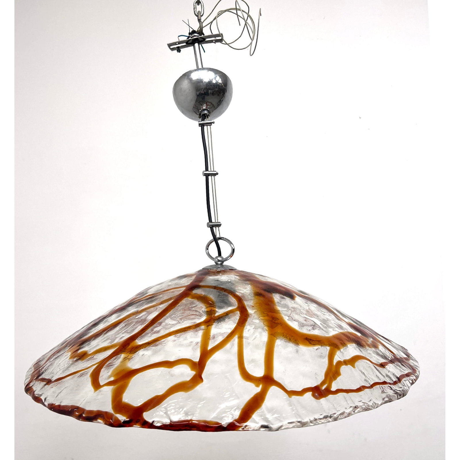 Mazzega Art Glass Saucer form Hanging Chandelier. Clear Glass with Caramel Glass Details. Chrome.: Mazzega Art Glass Saucer form Hanging Chandelier. Clear Glass with Caramel Glass Details. Chrome. Dimensions: Height: 8 inches, Width: 27 inches, Depth: 27 inches. ---