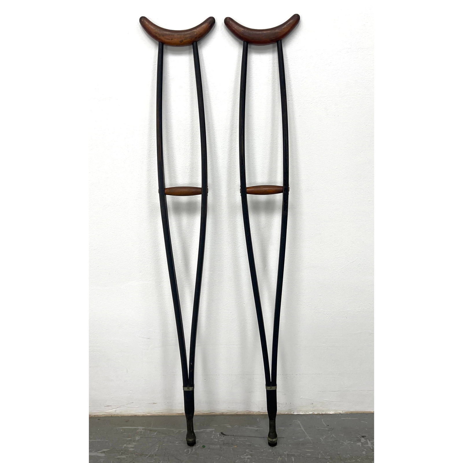 Pair Vintage Mid Century Modern Ebonized wood Crutches.: Pair Vintage Mid Century Modern Ebonized wood Crutches. Dimensions: Height: 48 inches, Width: 8 inches, Depth: 2 inches. ---