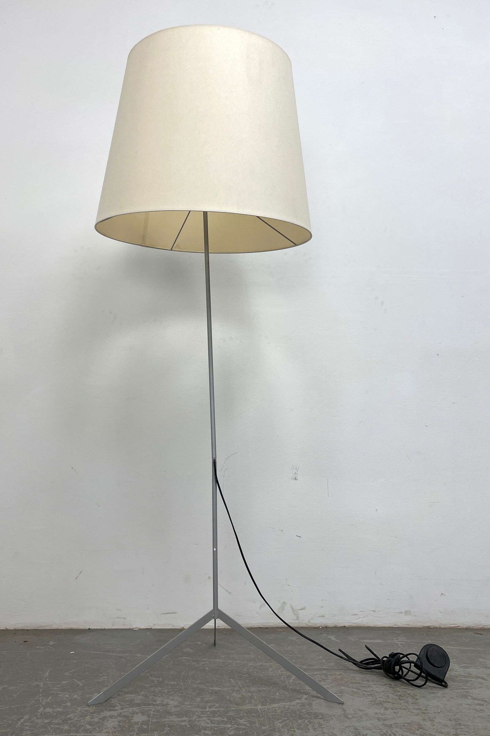 MOOOI Modern Floor Lamp. Fabric Shade. Tripod Base. Designed by MARCEL WANDERS. Orig Retail $1190: MOOOI Modern Floor Lamp. Fabric Shade. Tripod Base. Designed by MARCEL WANDERS. Orig Retail was $1190. Dimensions: Height: 64 inches, Width: 22 inches, Depth: 22 inches. ---