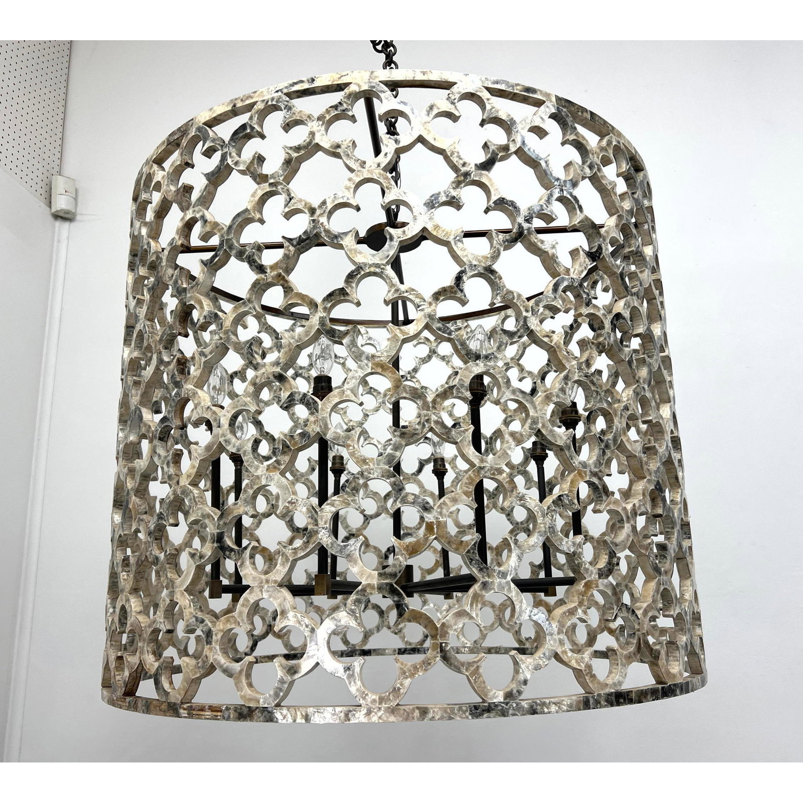 Capiz shell Veneer Shade Hanging Light. Quatrefoil Pattern. 8 interior arms with small bulbs.: Capiz shell Veneer Shade Hanging Light. Quatrefoil Pattern. 8 interior arms with small bulbs. Dimensions: Height: 29 inches, Width: 34 inches, Depth: 34 inches. --- - We offer curbside delivery for mo
