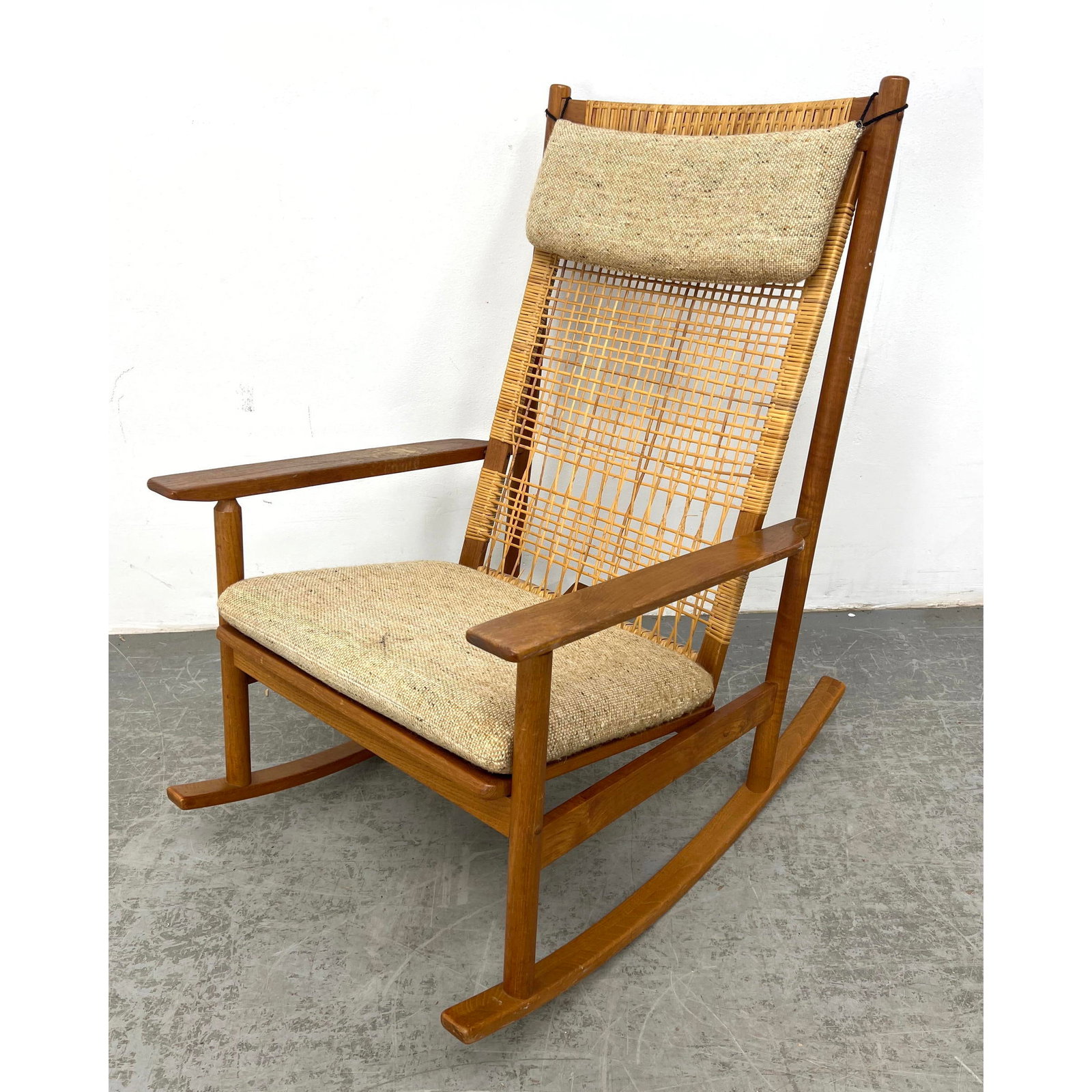 HANS OLSEN Danish Teak Modern Rocking Chair. Teak Rocker Frame has Woven Back. Fabric seat cushion A: HANS OLSEN Danish Teak Modern Rocking Chair. Teak Rocker Frame has Woven Back. Fabric seat cushion AND Head Rest Cushion (Sometimes missing). Not Marked. Dimensions: Height: 39 inches, Width: 23 inche