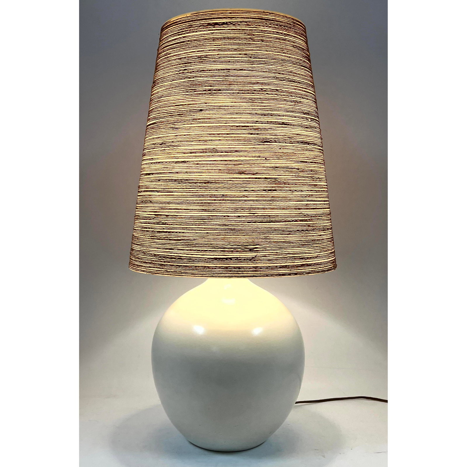 Gunnar and Lotte Bostlund Ceramic Lamp with Rope wrapped Fiberglass Shade.: Gunnar and Lotte Bostlund Ceramic Lamp with Rope wrapped Fiberglass Shade. Dimensions: Height: 29 inches, Width: 13 inches, Depth: 13 inches. --- - We offer curbside delivery for most items to NYC, Ma