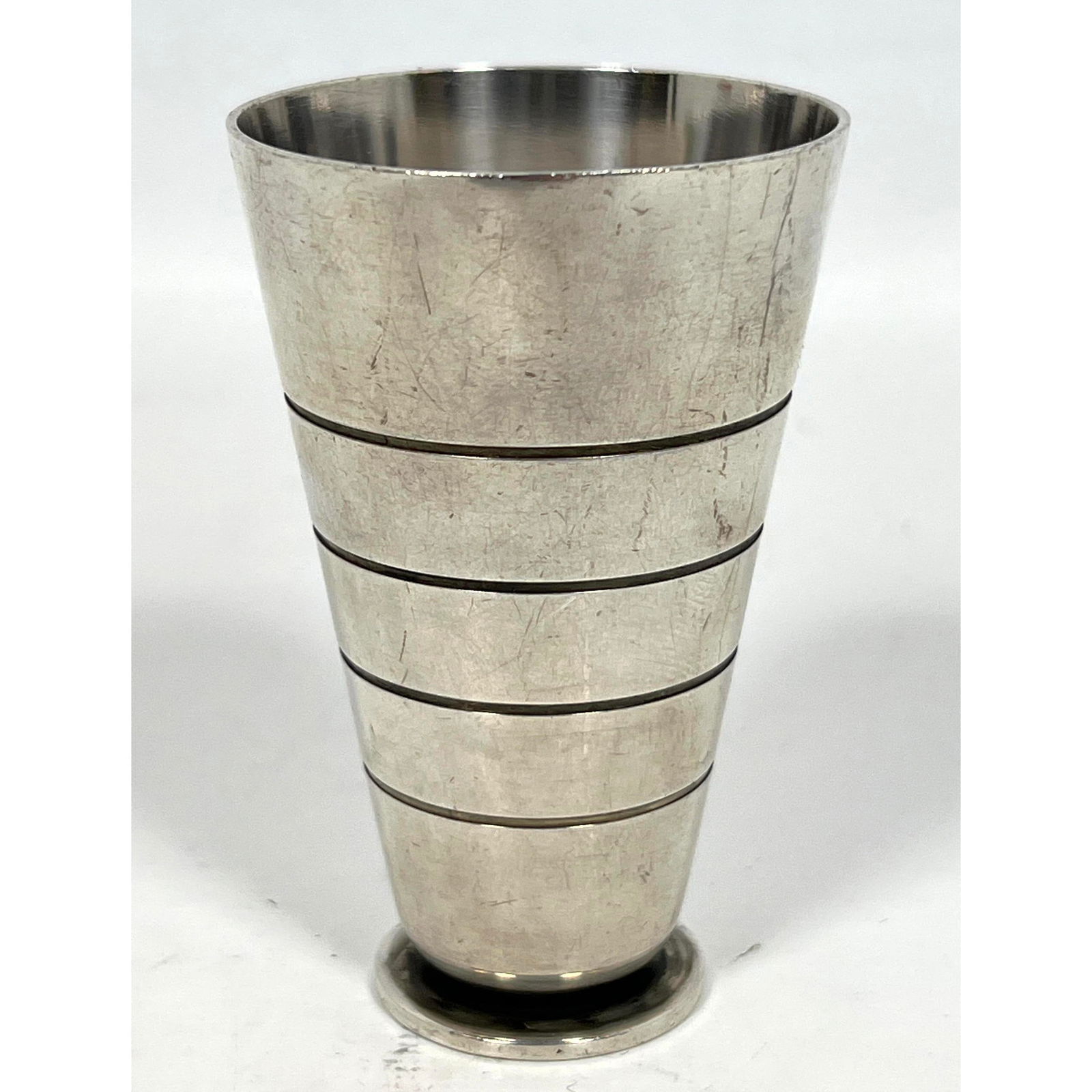 GEORG JENSEN by SIGVARD BERNADOTTE Sterling Beaker. Art Moderne style. Marked. #716: GEORG JENSEN by SIGVARD BERNADOTTE Sterling Beaker. Art Moderne style. Marked. #716 Dimensions: Height: 3 inches, Width: 1.75 inches, Depth: 1.75 inches. Weight: 2.17 Troy ozs. --- US Packing and Ship