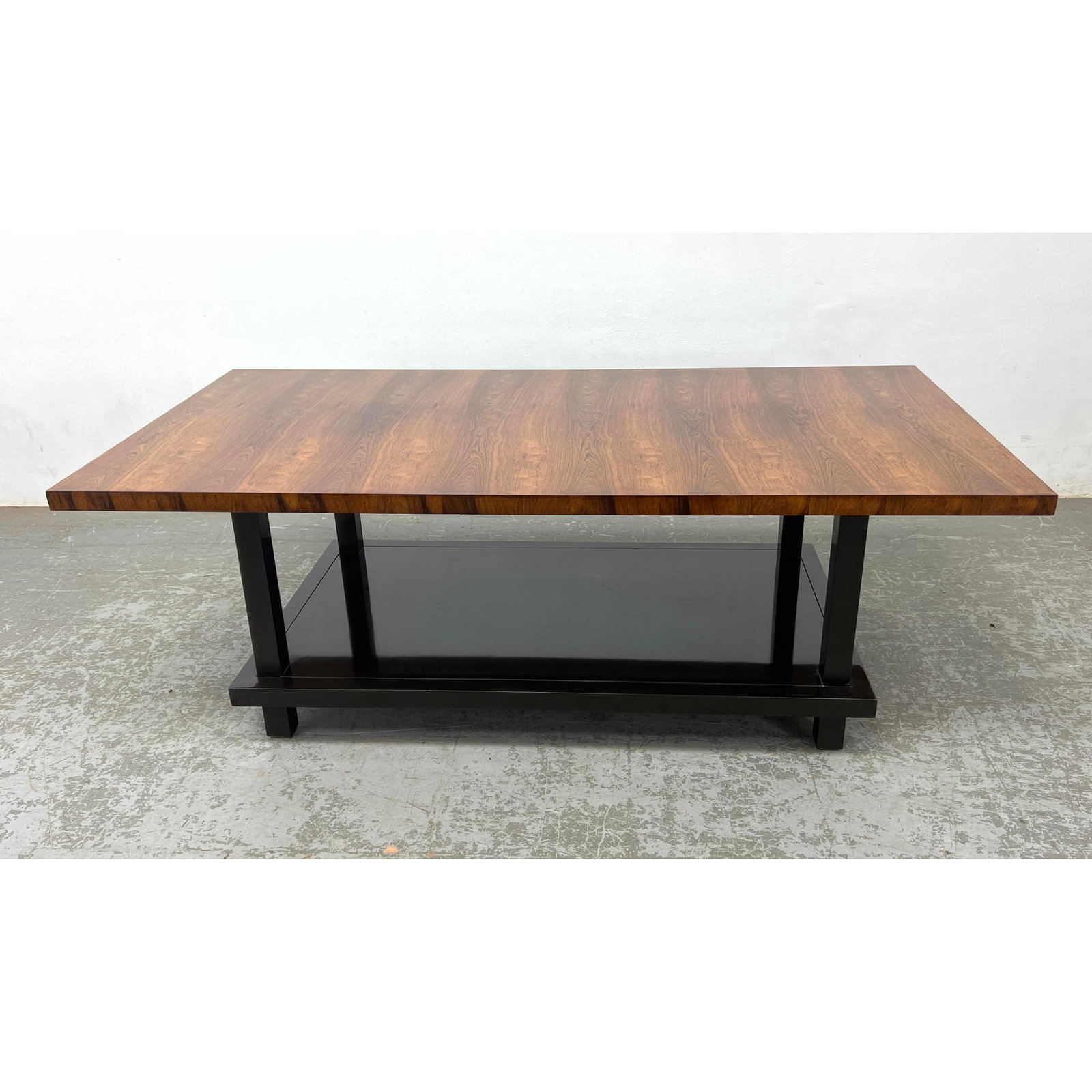 Councill Coffee table. Rosewood with ebonized base. Signed on the bottom: Councill Coffee table. Rosewood with ebonized base. Signed on the bottom Dimensions: Height: 20.5 inches, Width: 58 inches, Depth: 30 inches. ---