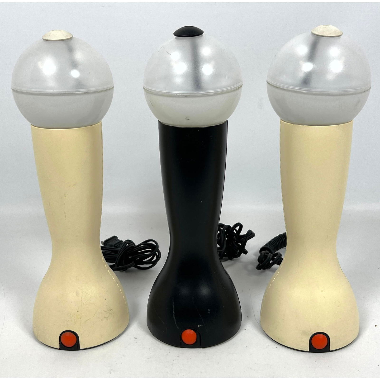 3pc ARTEMIDE Milano Modernist Lamps. Black or Off White Plastic Forms with Clear Ball Lights. Marked: 3pc ARTEMIDE Milano Modernist Lamps. Black or Off White Plastic Forms with Clear Ball Lights. Marked. Italian Modernist Lighting. Dimensions: Height: 13.25 inches, Width: 4.25 inches, Depth: 4.25 inch