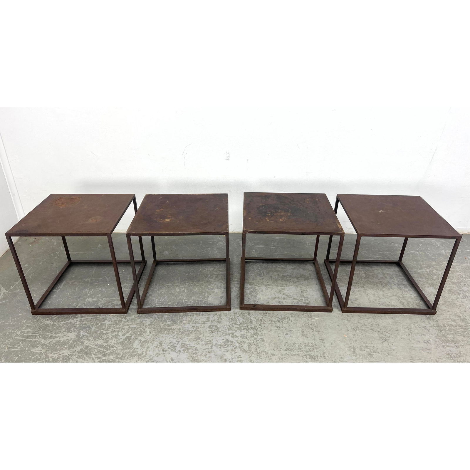 4pc Rusted Steel Open Frame Tables. These can stack.: 4pc Rusted Steel Open Frame Tables. These can stack. Dimensions: Height: 32 inches, Width: 16 inches, Depth: 16 inches. ---
