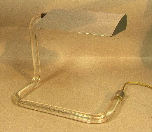 KOVACS Lucite Chrome Desk Table Lamp. Chrome shad: KOVACS Lucite Chrome Desk Table Lamp. Chrome shade supported by Lucite rod base. Designed with cord concealed in the Lucite tube. Unmarked.-- Dimensions: H: 11 inches: W: 14 inches: D: 8 inches --- US