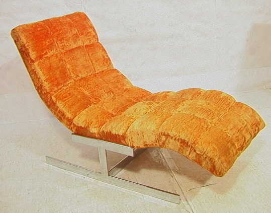 MILO BAUGHMAN Orange Lounge Chair. Flat Chrome Ba: MILO BAUGHMAN Orange Lounge Chair. Flat Chrome Base. 70's Modern orange upholstery. -- Dimensions: H: 34 inches: D: 25 inches: L: 59 inches ---