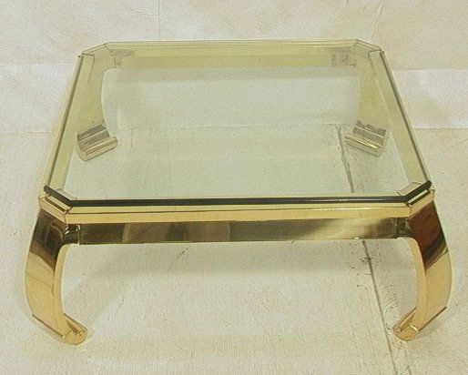 Large Italian Brass and Glass Coffee Cocktail Tab: Large Italian Brass and Glass Coffee Cocktail Table. .75 in thick beveled glass. Mastercraft style.-- Dimensions: H: 15.5 inches: W: 41 inches ---