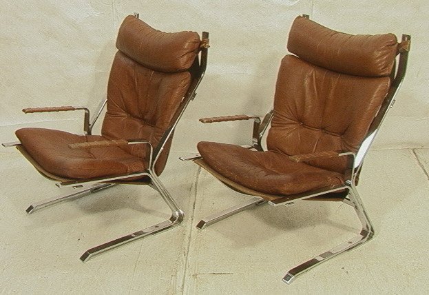 Pr Chromed Steel Lounge Chairs. Brown Leather Uph: Pr Chromed Steel Lounge Chairs. Brown Leather Upholstery. Canvas Sling Seat with Brown Leather Tufted Cushion. Heavy construction flat chrome. 2pcs-- Dimensions: H: 35 inches: W: 25 inches: D: 31 inch