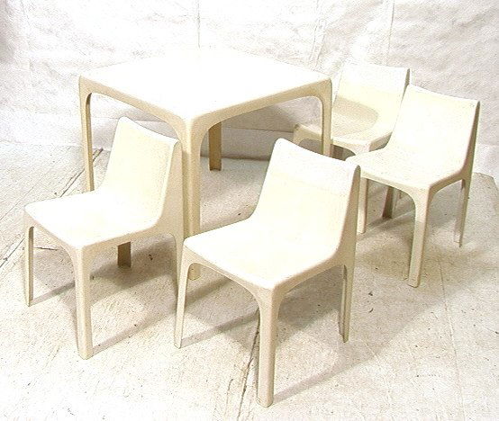 White Fiberglass Dining Table & 4 Chairs. Molded: White Fiberglass Dining Table & 4 Chairs. Molded Fiberglass. Chairs stack. Labeled: Made in Italy. -- Dimensions: ---