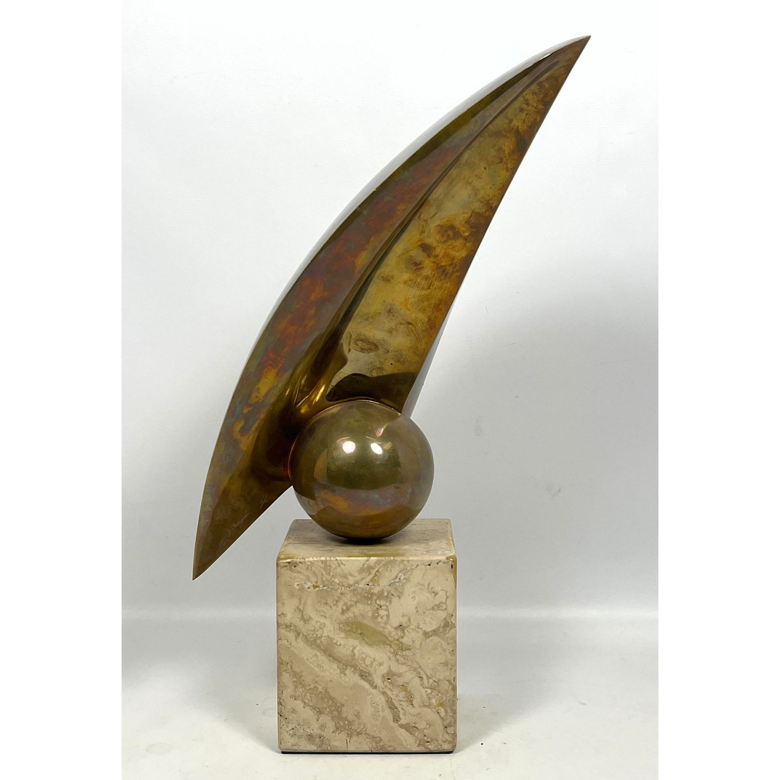 Signed Bronze Sculpture 7/12 on Travertine Base. Modernist Form.: Signed Bronze Sculpture 7/12 on Travertine Base. Modernist Form. Dimensions: Height: 19.5 inches, Width: 7.5 inches, Depth: 10 inches. --- US Packing and Shipping charge: In house shipping available.