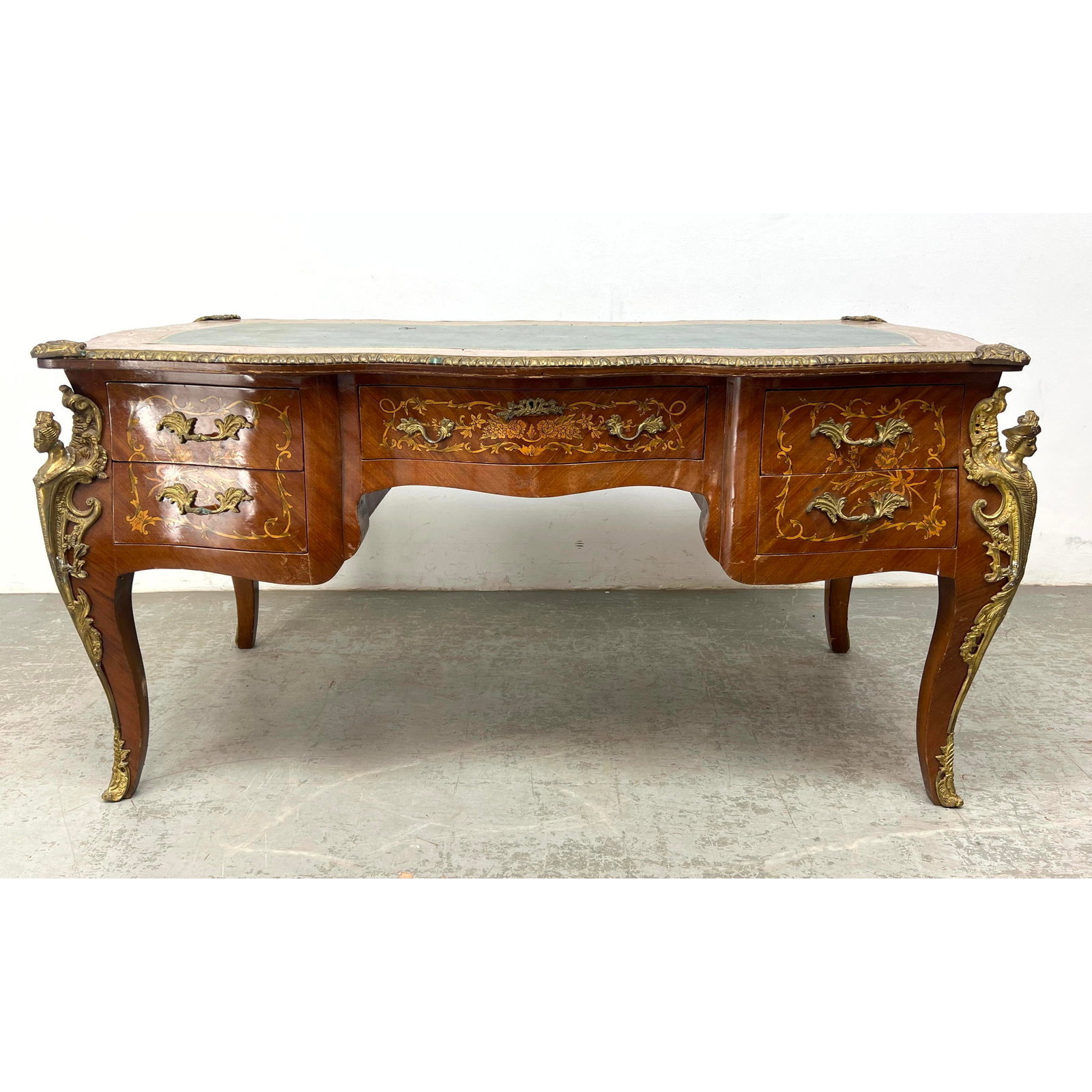 French style Inlaid Wood Desk. Embossed Green Leather Top. Brass figural ormolu mounts. (1 of 18)