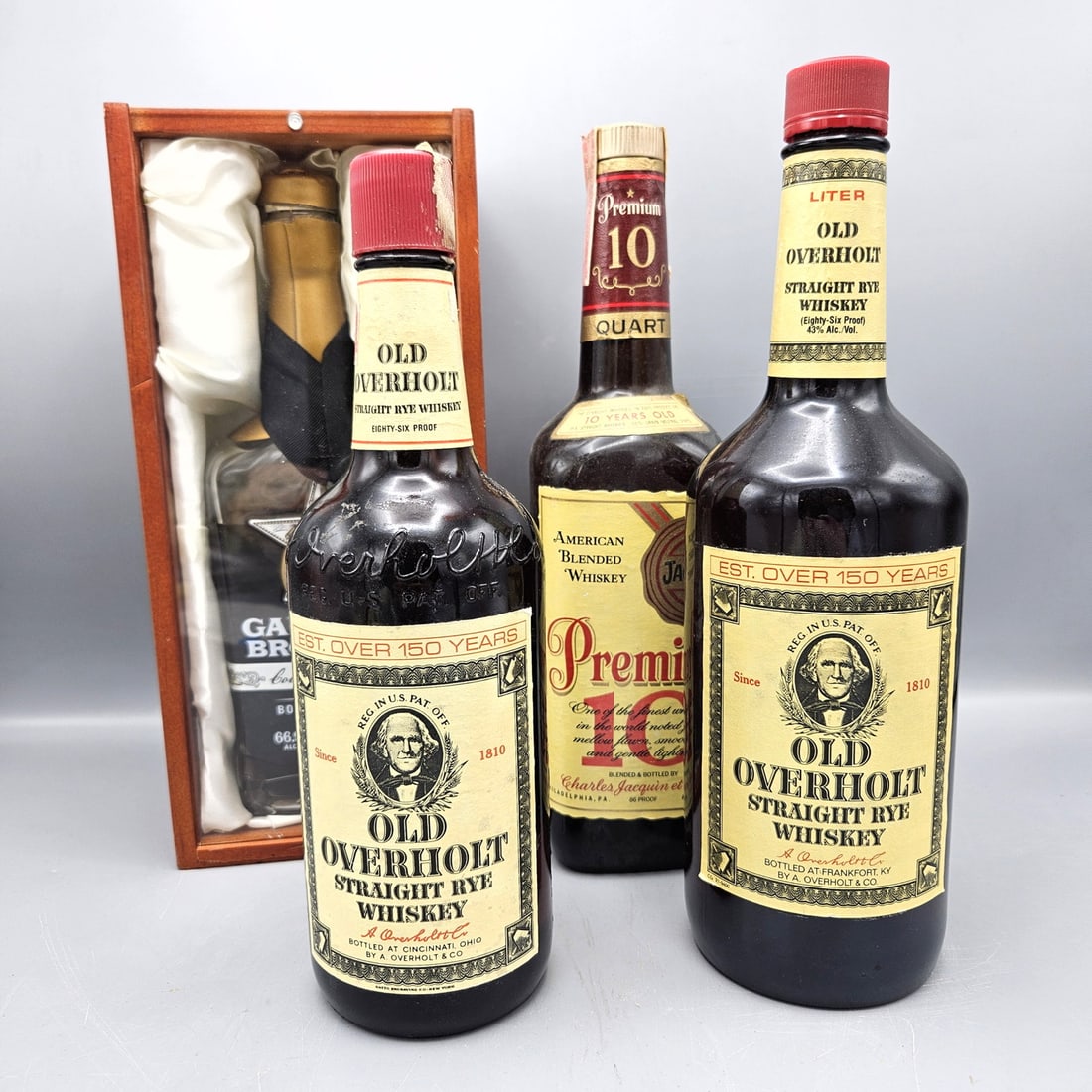 4 bottles Overholt (2), Premium 10, Garrison Bourbon Whiskey: 4 bottles Overholt (2), Premium 10, Garrison Bourbon Whiskey --- Buyers are encouraged to pick up their purchases directly from our location. Please note: we do not offer shipping for spirits to any d