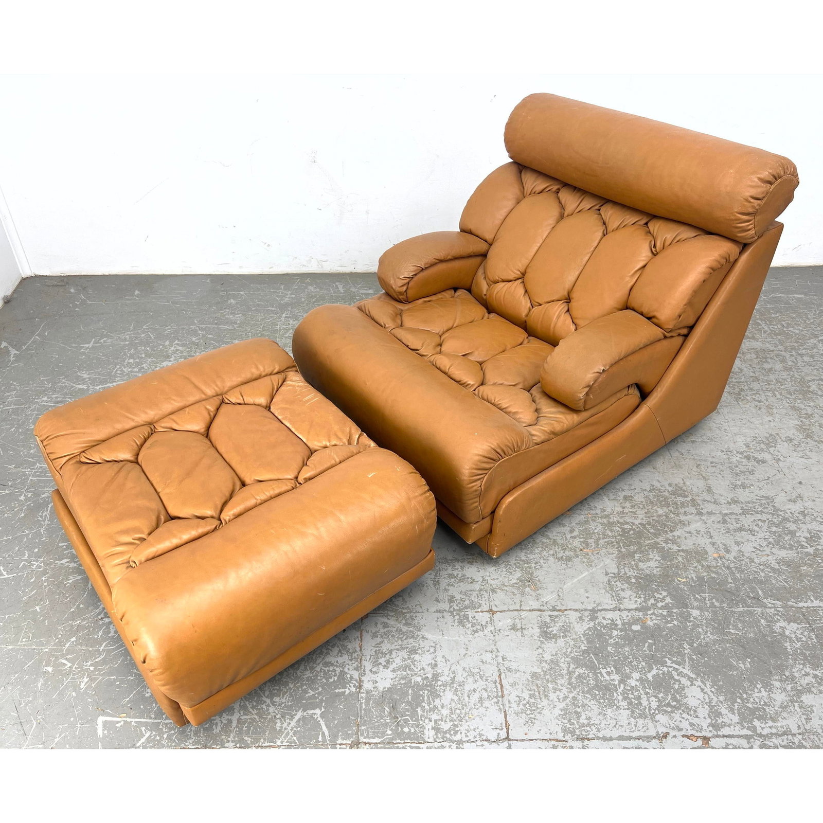 1970s Tan Leather Lounge chair and Ottoman Style of De Sede: 1970s Tan Leather Lounge chair and Ottoman Style of De Sede Dimensions: Height: 33 inches, Width: 32 inches, Depth: 42 inches. - Seat Height: 16 inches - Additional Dimensions: Ottoman H: 16 inches, W
