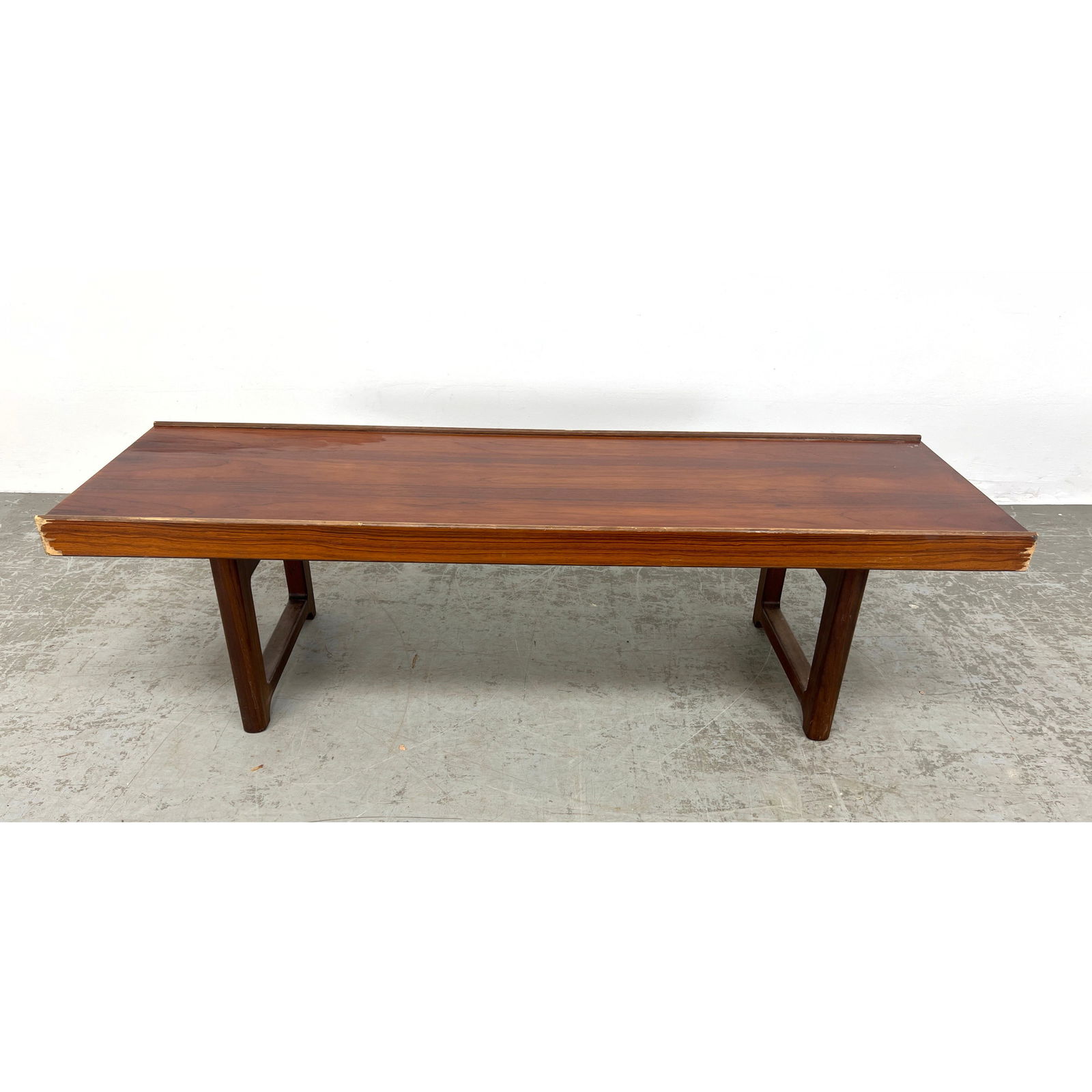 Torbjorn Afdal for Bruksbo rosewood table or bench with low profile and sculpted sides.: Torbjorn Afdal for Bruksbo rosewood table or bench with low profile and sculpted sides. Dimensions: Height: 13 inches, Width: 47.5 inches, Depth: 14.5 inches. --- - We offer curbside delivery for most